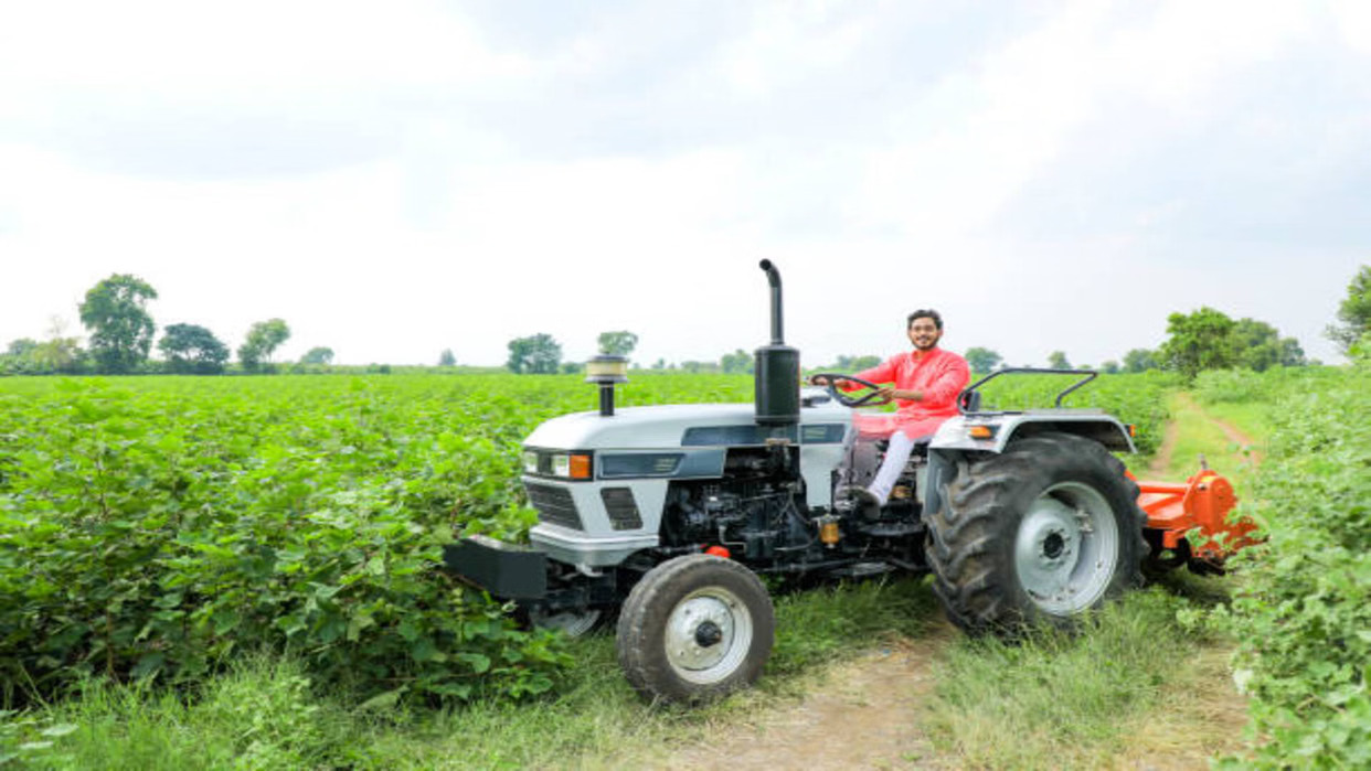 Farmer using a tractor in a field